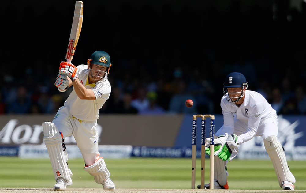 Australia's David Warner plays a shot off the bowling of England's Moeen Ali on the fourth day of the second Ashes Test match between England and Australia, at Lord's cricket ground in London.