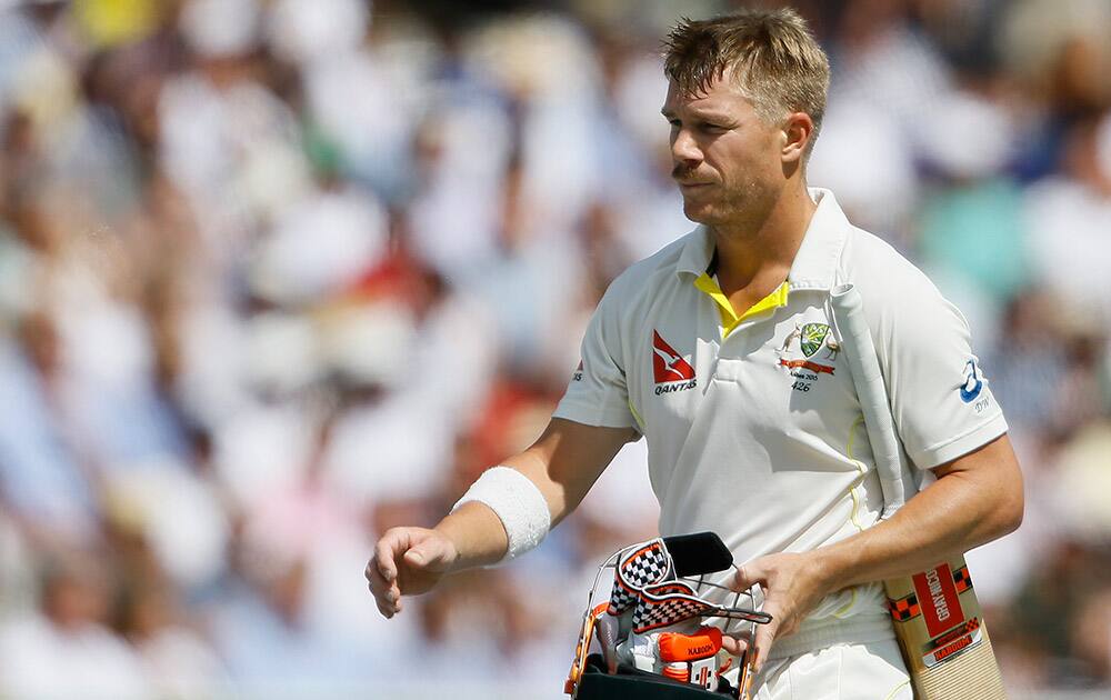 Australia's David Warner leaves the pitch after being caught by Alastair Cook off the bowling of England's Moeen Ali on the fourth day of the second Ashes Test match between England and Australia, at Lord's cricket ground in London.