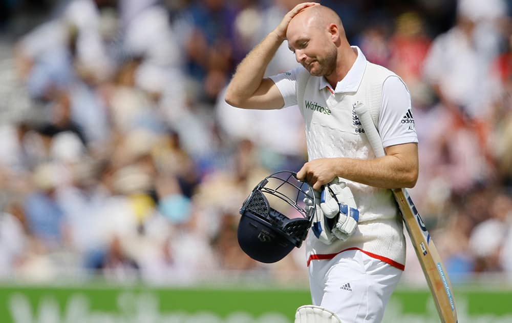 England's Adam Lyth leaves the pitch after being caught by Peter Nevill off the bowling of Australia's Mitchell Starc on the fourth day of the second Ashes Test match between England and Australia, at Lord's cricket ground in London.