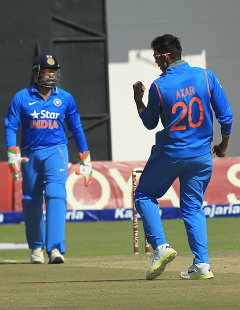 Axar Patel celebrates the wicket of Zimbabwe's Chamunorwa Chibhabha in the Twenty20 cricket match in Harare, Zimbabwe.