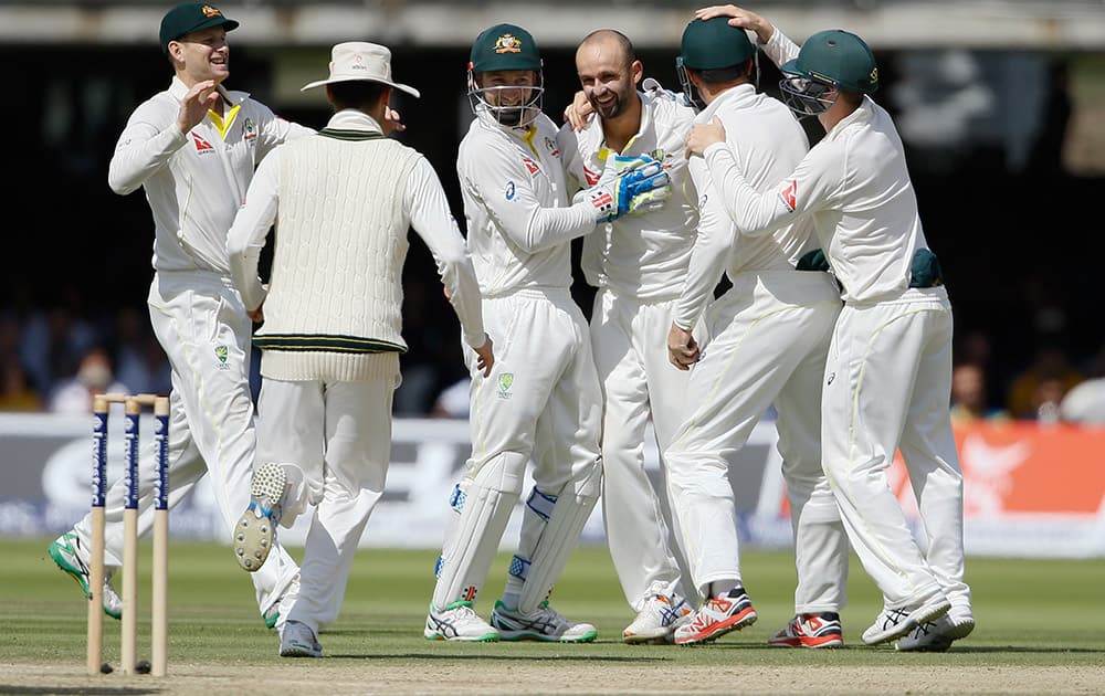 Australia's Nathan Lyon celebrates taking the wicket of England's Ian Bell on the fourth day of the second Ashes Test match between England and Australia, at Lord's cricket ground in London.