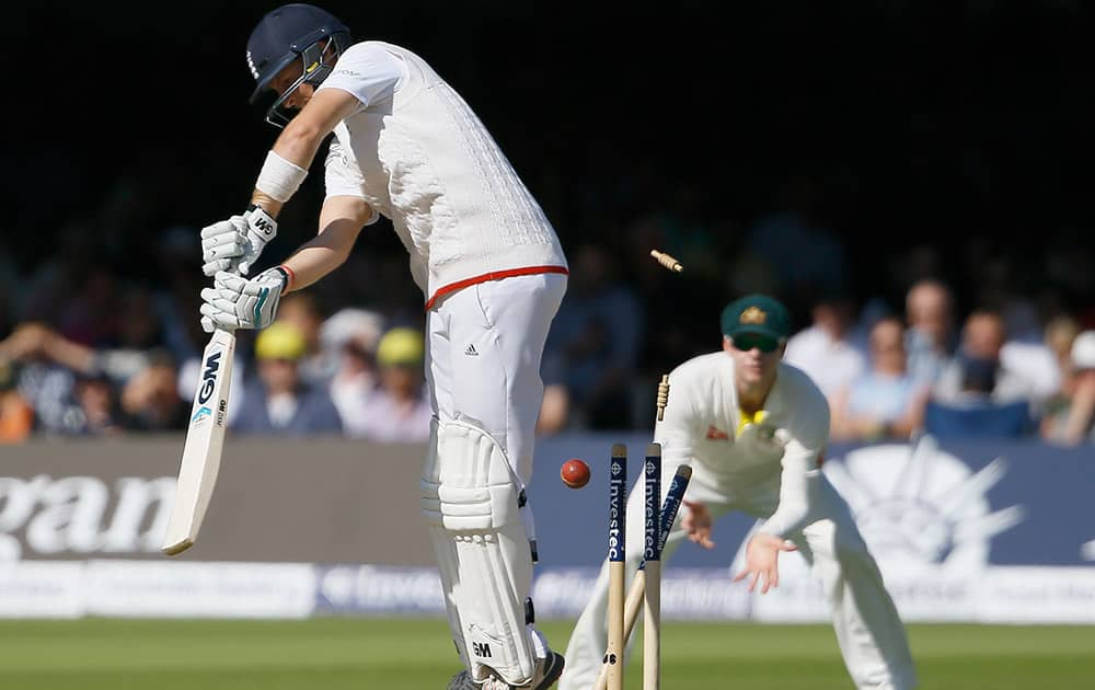 England's Joe Root is bowled by Australia's Josh Hazlewood on the fourth day of the second Ashes Test match between England and Australia, at Lord's cricket ground in London.