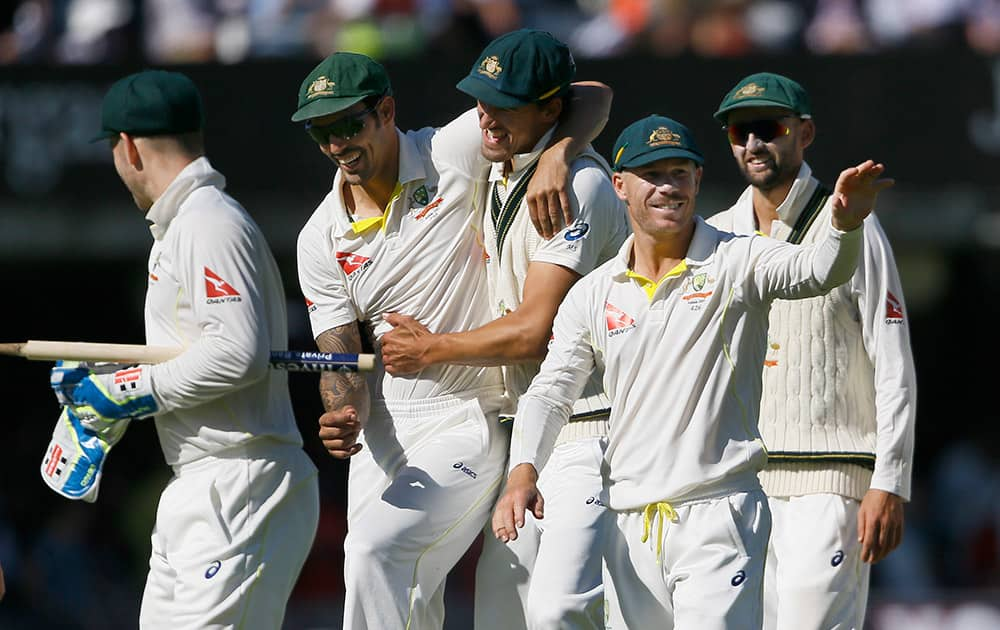 Australia's players celebrate winning the match by 405 run on the fourth day of the second Ashes Test match between England and Australia, at Lord's cricket ground in London.