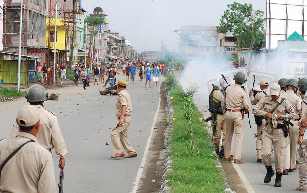 Police fire tear gas to disperse protesters at Tera, Imphal West on Monday demanding Inner Line Permit System in Manipur. 