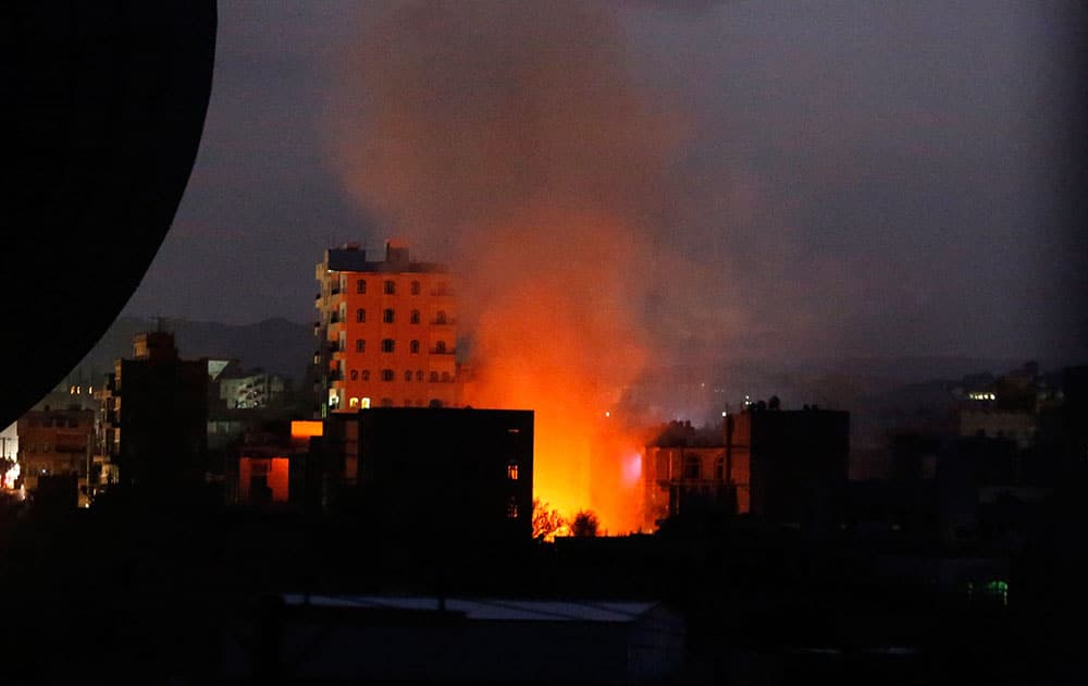 Fire and smoke rise from the site of a car bomb attack in Sanaa, Yemen.