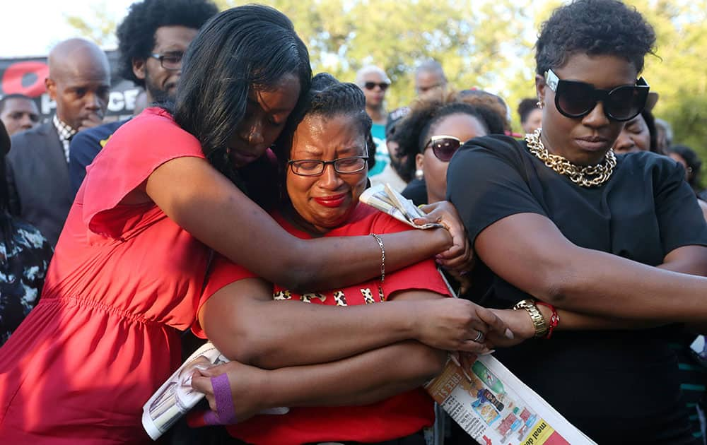 Lanitra Dean hugs Carlesha Harrison, a friend of Sandra Bland, during a vigil for Bland at Prairie View A&M University, in Prairie View, Texas.