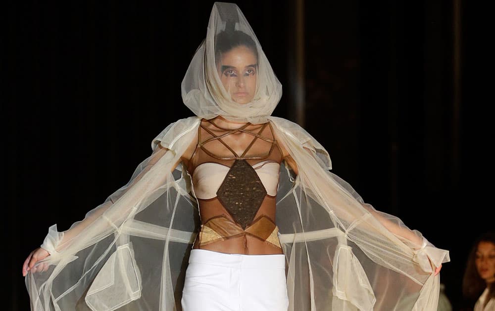 A model shows of an outfit by South African designer Suzaan Heyns during her show at the MODAAFRICA, African fashion week in Lisbon.