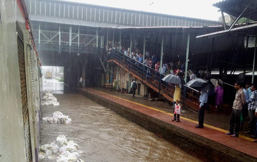 A view of waterlogged railway track at Sion station of CR after overnight incessant rains in Mumbai.