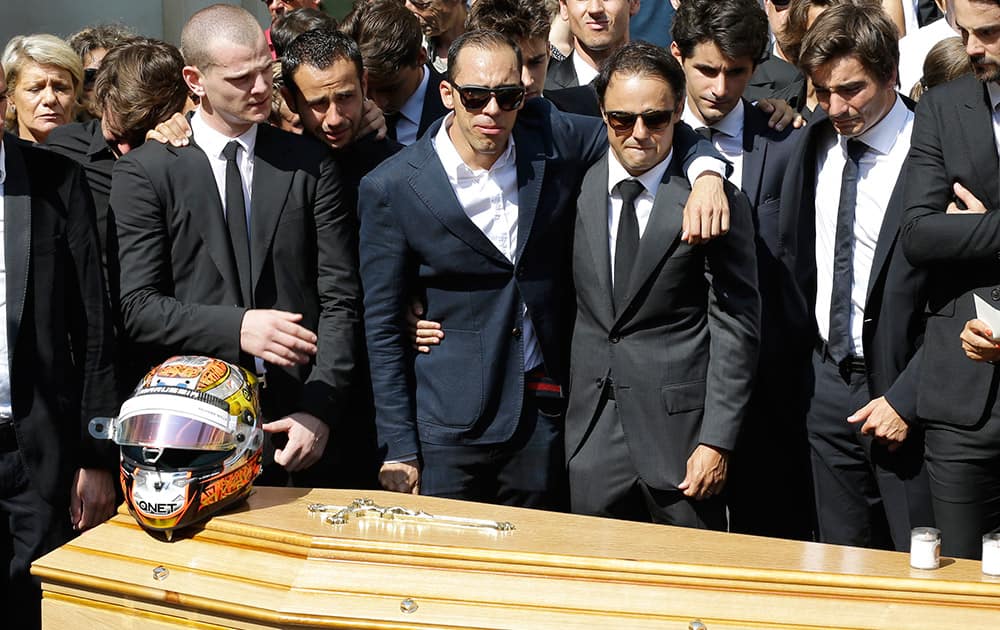 Fellow driver Brazilian Felipe Massa, second from right, stands with other friends and relatives in front of the casket of French Formula One driver Jules Bianchi into Sainte Reparate Cathedral during his funeral in Nice, French Riviera.