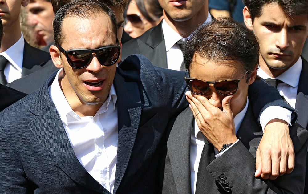 Drivers Brazilian Felipe Massa, right, and Venezuela's Pastor Maldonado, stand in front of the casket of French Formula One driver Jules Bianchi into Sainte Reparate Cathedral during his funeral in Nice, French Riviera.