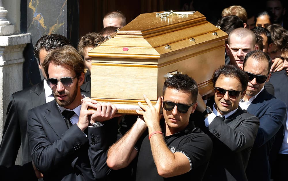 French Formula One driver Jean Eric Vergne, left, Brazilian Formula One driver Felipe Massa, second right, and Venezuelan Formula One driver Pastor Maldonado, right, carry the casket of French Formula One driver Jules Bianchi into Sainte Reparate Cathedral during his funeral in Nice, French Riviera.