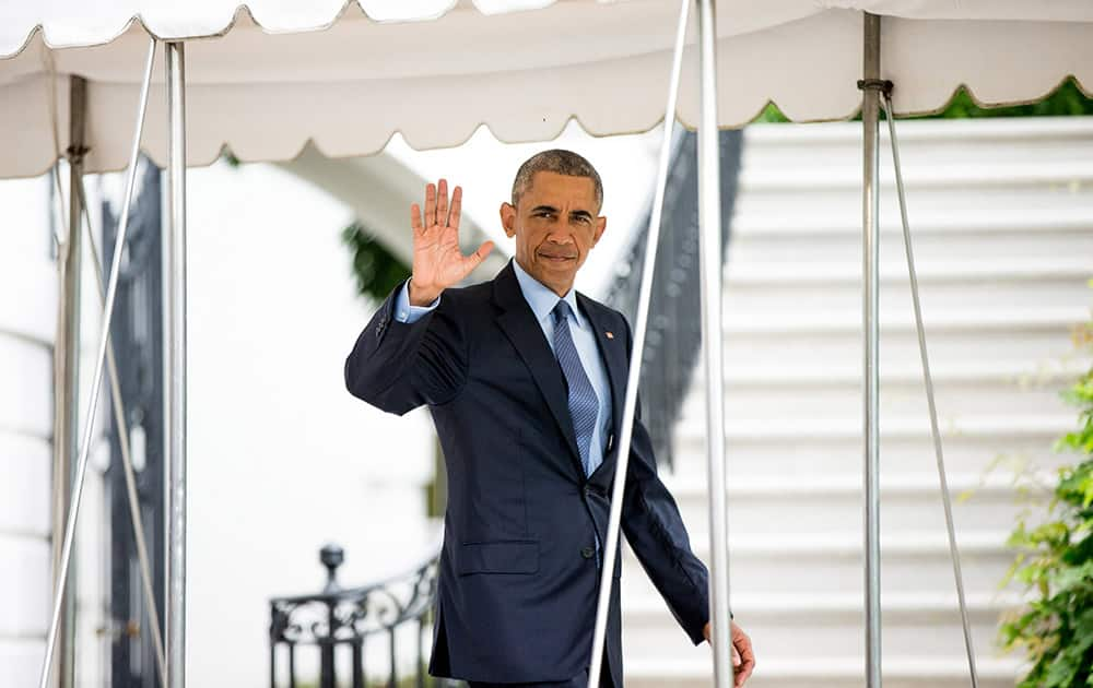 President Barack Obama waves to members of the media as he walks towards Marine One on the South Lawn at the White House in Washington, for a short trip to Andrews Air Force Base to travel to Pittsburgh where the President will address the 116th National Convention of the Veterans of Foreign Wars. 