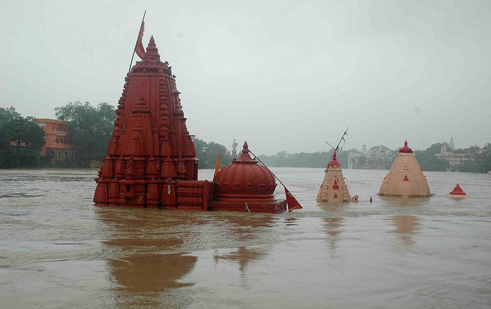 Temples submerged on the banks of flooded Kshipra River due to heavy rains in Ujjain.