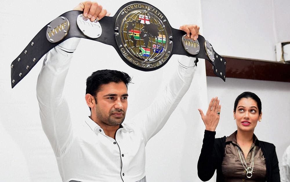 Sangram Singh who won the World Wrestling Professionals (WWP) Commonwealth Wrestling Heavyweight championship along with his fiancee Payal Rohatgi during a press conference in Mumbai.