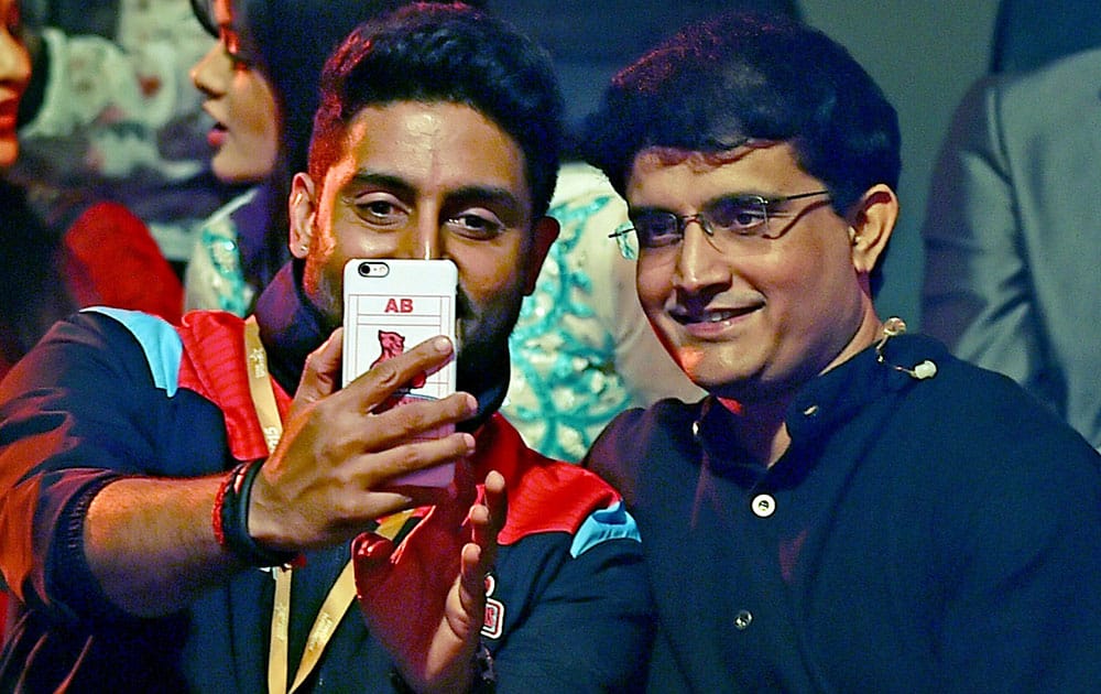 Bollywood actor and owner of Jaipur Pink Panthers Abhisekh Bachchan takes selfie with former Cricketer Sourav Ganguly during Pro Kabaddi league match against Bengal Warriors in Kolkata.