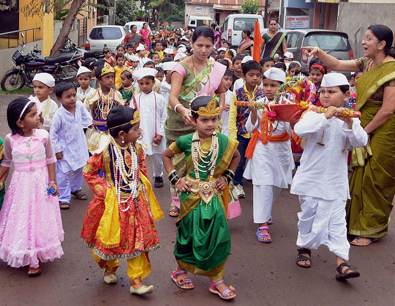 Children participate in the Dindi procession ahead of the Ashadhi Ekadashi in Karad, Maharashtra.