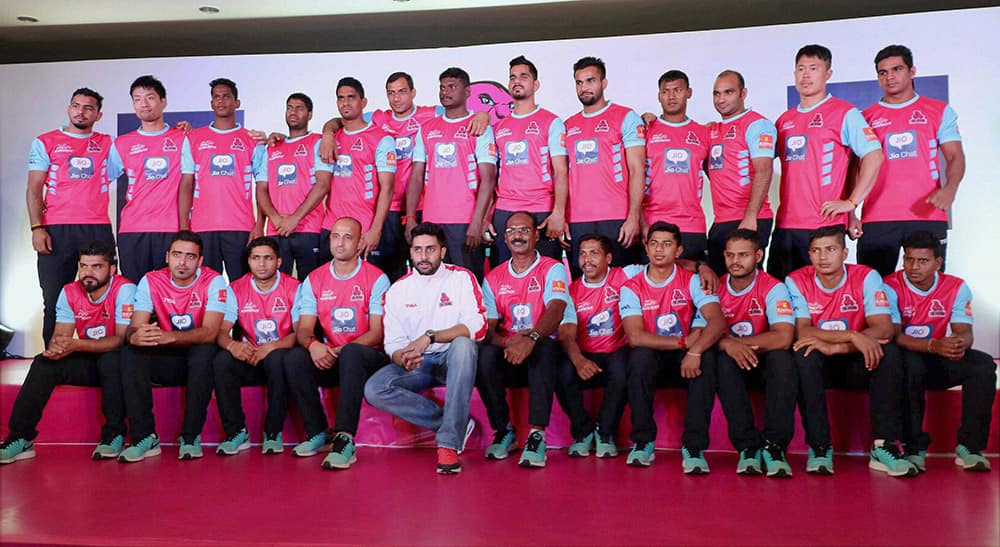 Actor Abhishek Bachchan, owner of Jaipur Pink Panthers team poses with his team before the press ahead of the Pro Kabaddi matches in Jaipur.