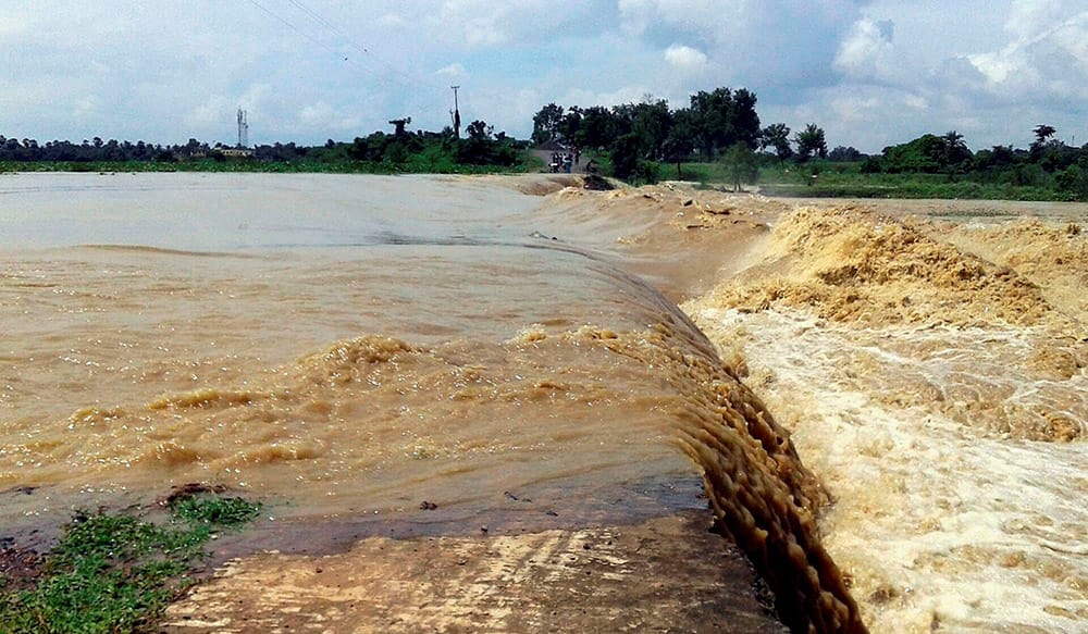 The National Highway 80 is washed out by flood waters after heavy rains at Nishindhapur in Murshidabad, West Bengal.