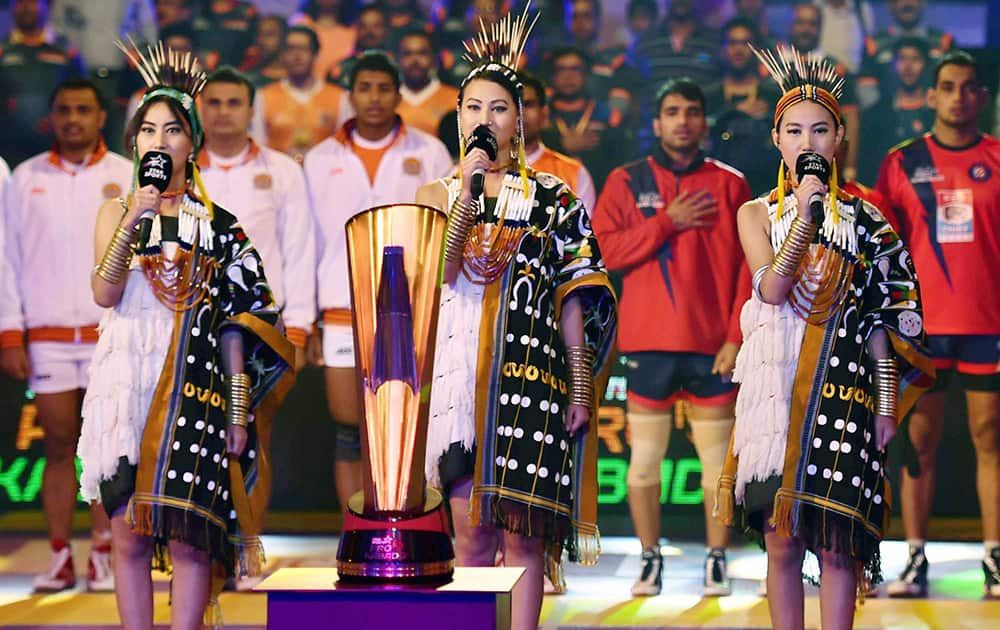 Girls wearing traditional dresses and sing National anthem prior to start the match between Dabang Delhi and Puneri Paltan during Pro Kabaddi league match in Kolkata.