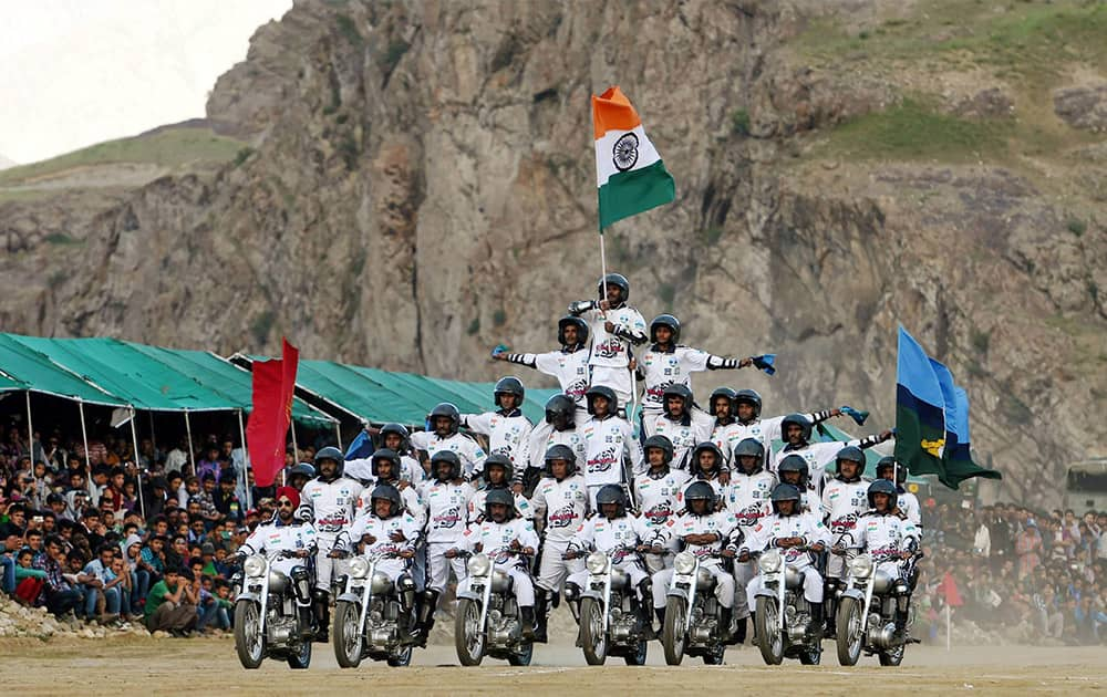 Army daredevils performing stunts at Drass Sector of district Kargil on Friday as part of celebrations of 16th anniversary of Operation Vijay.