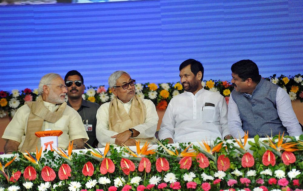 Prime Minister Narendra Modi with Bihar Chief Minister Nitish Kumar and Union Ministers Ram Vilas Paswan and Dharmendra Pradhan at a function for the launch of a number of government schemes in Patna.