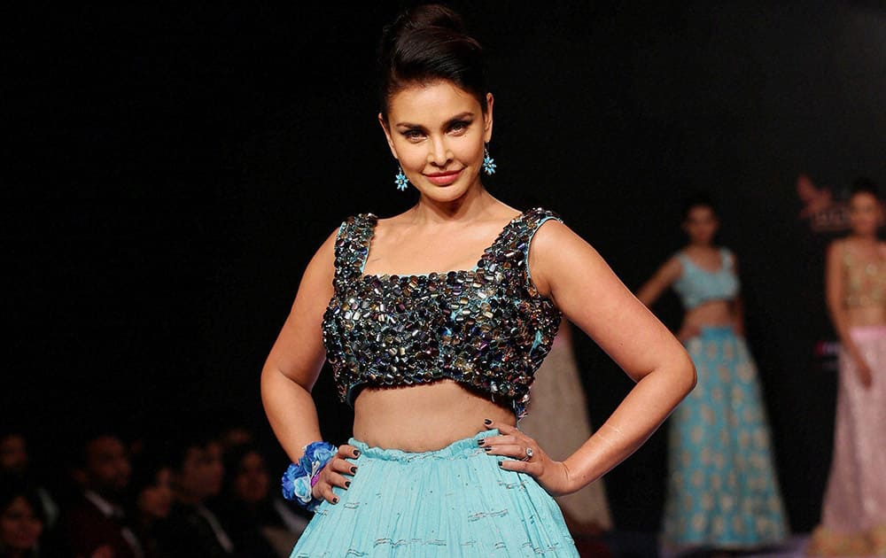 Bollywood actress Lisa Ray showcases the creation of designer Riya Kodali on the second day of 13th edition Bangalore Fashion Week 2015 in Bengaluru.