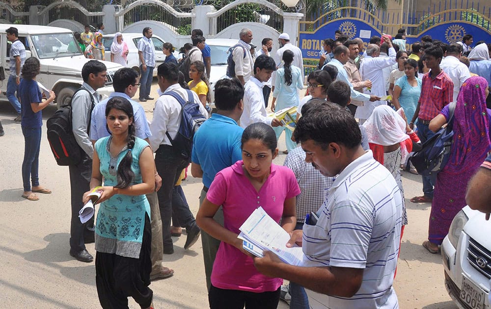 Students coming out of an examination centre after appearing in All India Pre-medical Entrance Exam in Gurgaon.