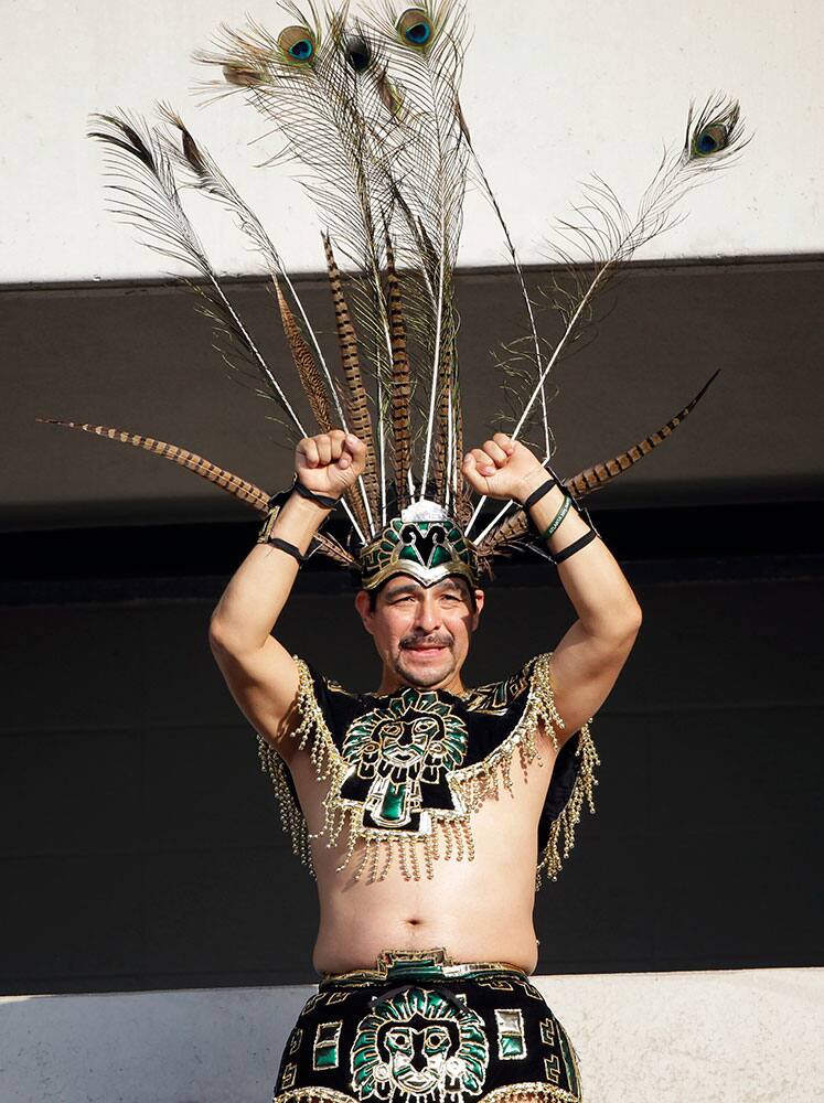 A Mexico fan cheers before the CONCACAF Gold Cup championship soccer match against Jamaica.