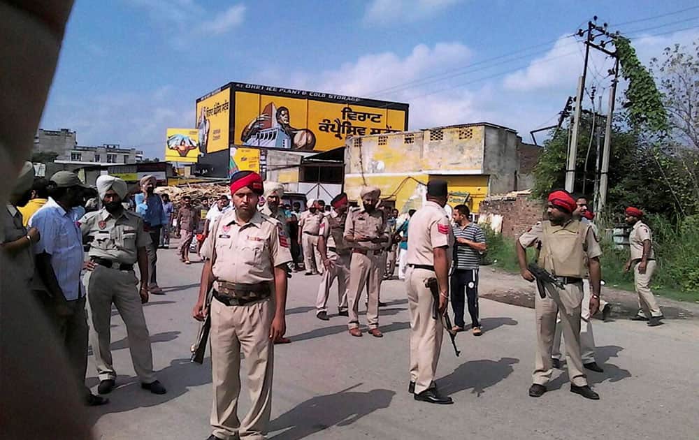 Punjab police personnel keep vigil during an encounter with armed militants near Dinanagar town in Gurdaspur district.