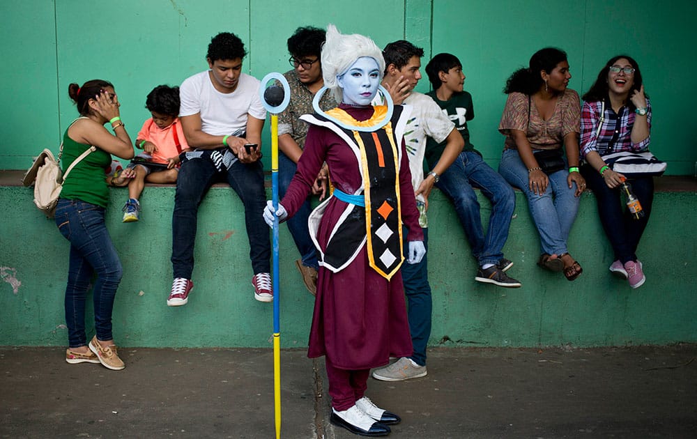 Cosplayer Gabriela Garcia, who portrays Dragon Ball Super character Whis, poses for a portrait during the 4th edition of the MiniCon Anime convention, at the School of Dance, in Managua, Nicaragua.