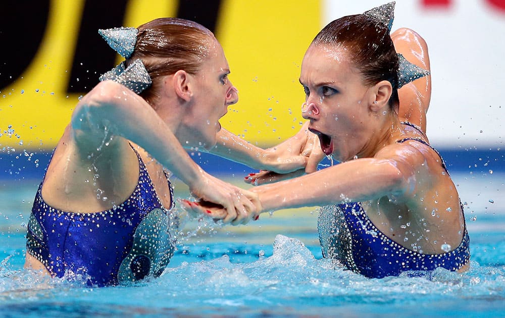 Russia's Natalia Ishchenko and Svetlana Romashina perform during the synchronised swimming duet free preliminary at the Swimming World Championships in Kazan, Russia.