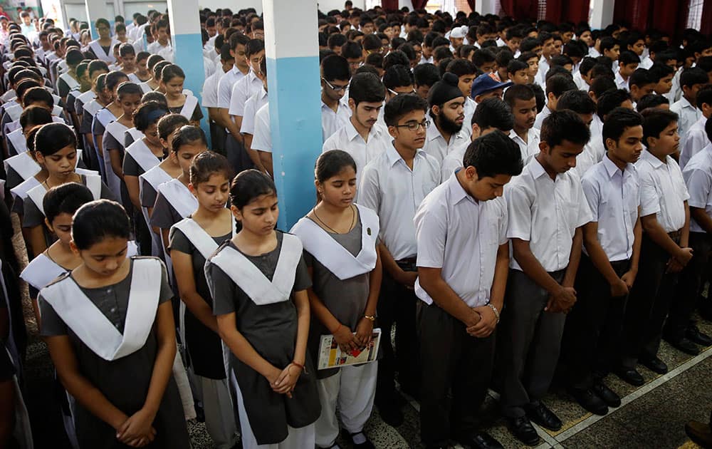 Students observe a moment of silence as they pay tribute to former President A.P.J. Abdul Kalam at CMS School in Lucknow, India.