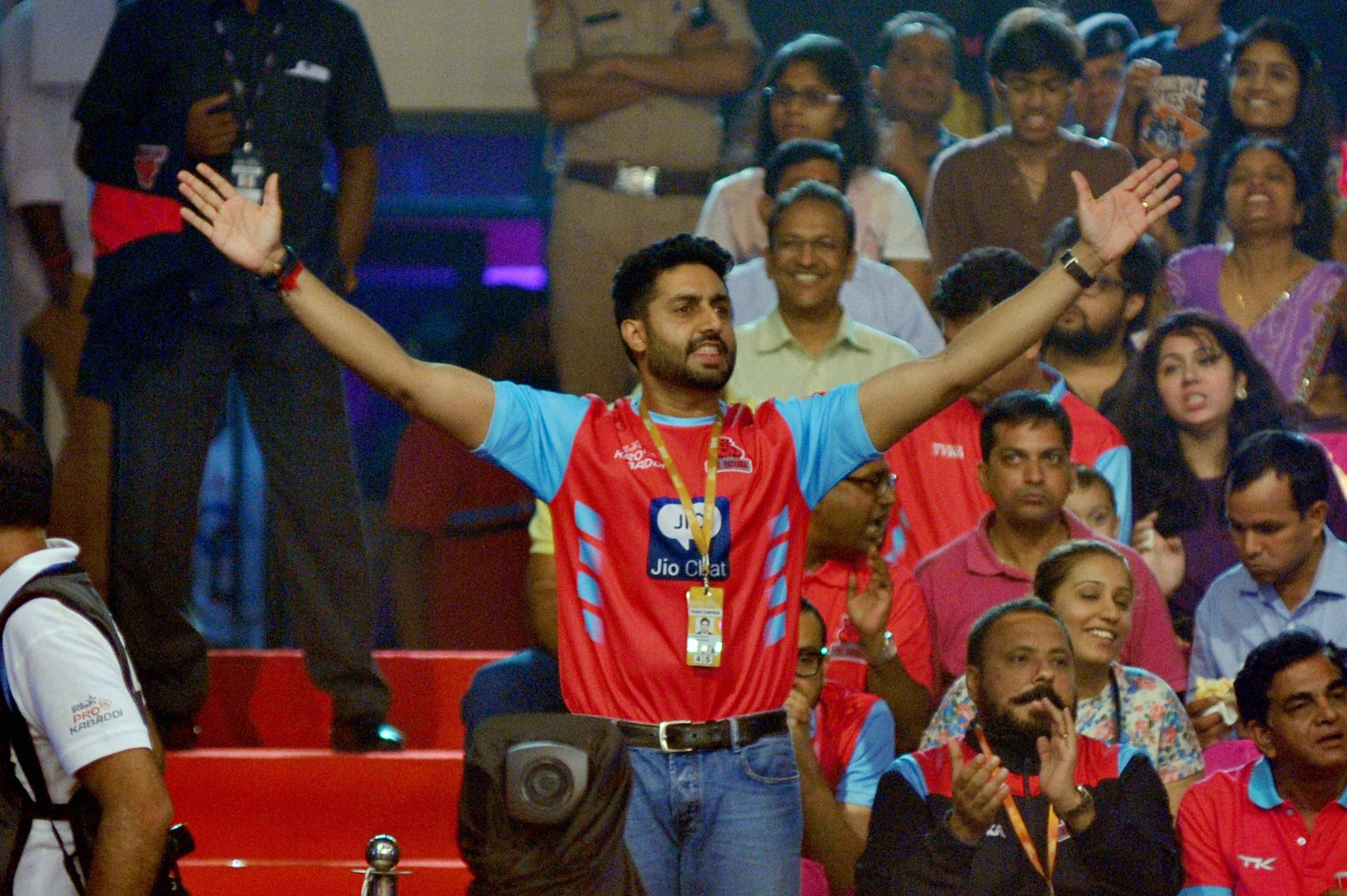 Bollywood actor Abhishek Bachchan cheers during Pro Kabaddi match between Jaipur Pink Panthers and Bengaluru Bulls at Sawai Mansingh Indoor Stadium in Jaipur.