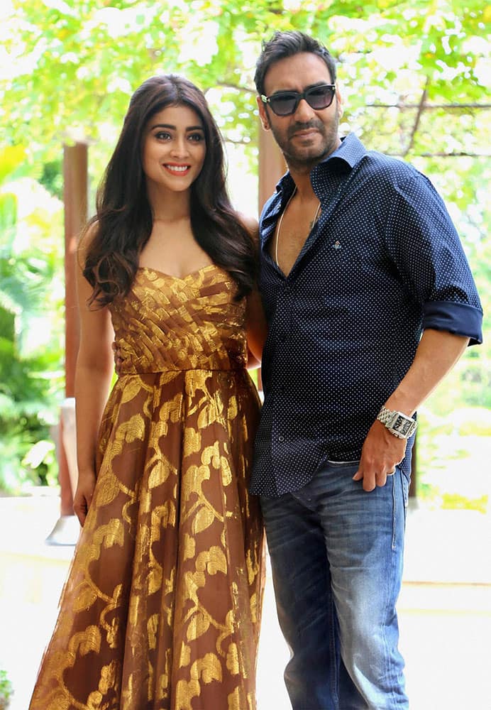 Actors Ajay Devgan and Shriya Saran during a promotional photo shoot for their film Drishyam, in New Delhi.