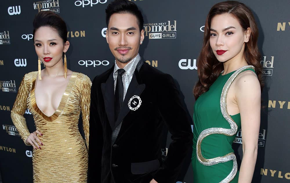 Vietnamese celebrities Ly Qui Khanh, center, Ho Ngoc Ha, right, and Toc Tien, pose on the 'green' carpet at the America's Next Top Model Cycle 22 premiere party in Los Angeles.