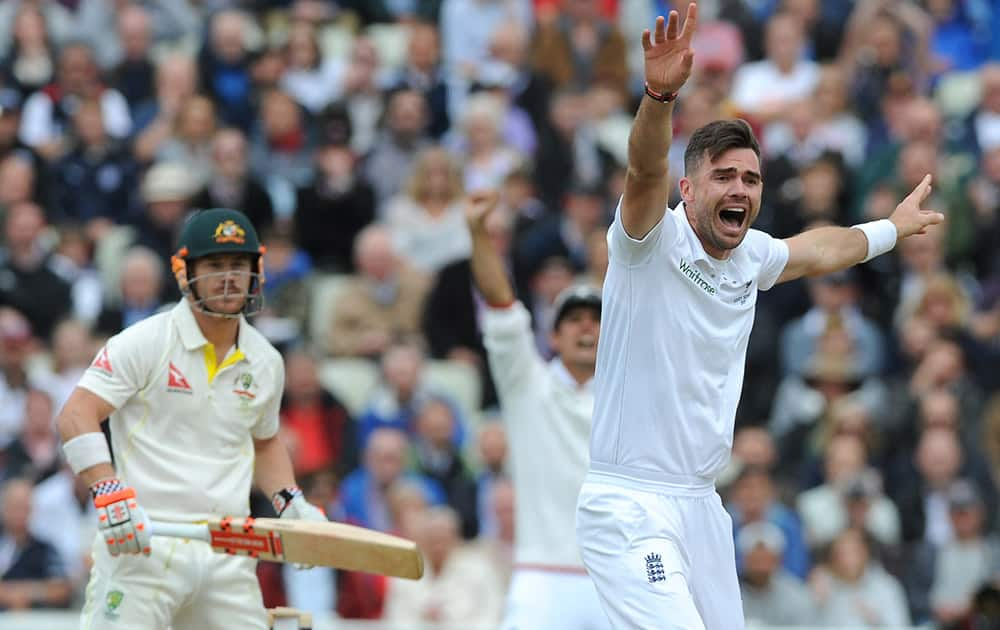 England’s James Anderson celebrates after trapping Australia’s David Warner, LBW for 2 runs during day one of the third Ashes Test cricket match, at Edgbaston, Birmingham, England.