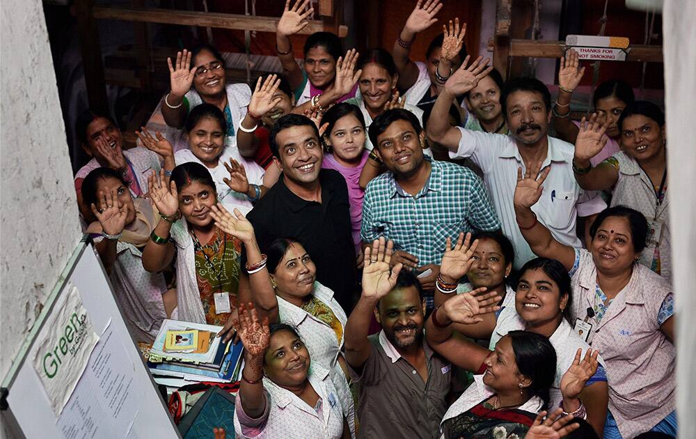 Human Rights activist Anshu Gupta jubilates with the colleagues of his NGO after his name was announced among the five awardees by Ramon Magsaysay Award Foundation (RMAF), in New Delhi.