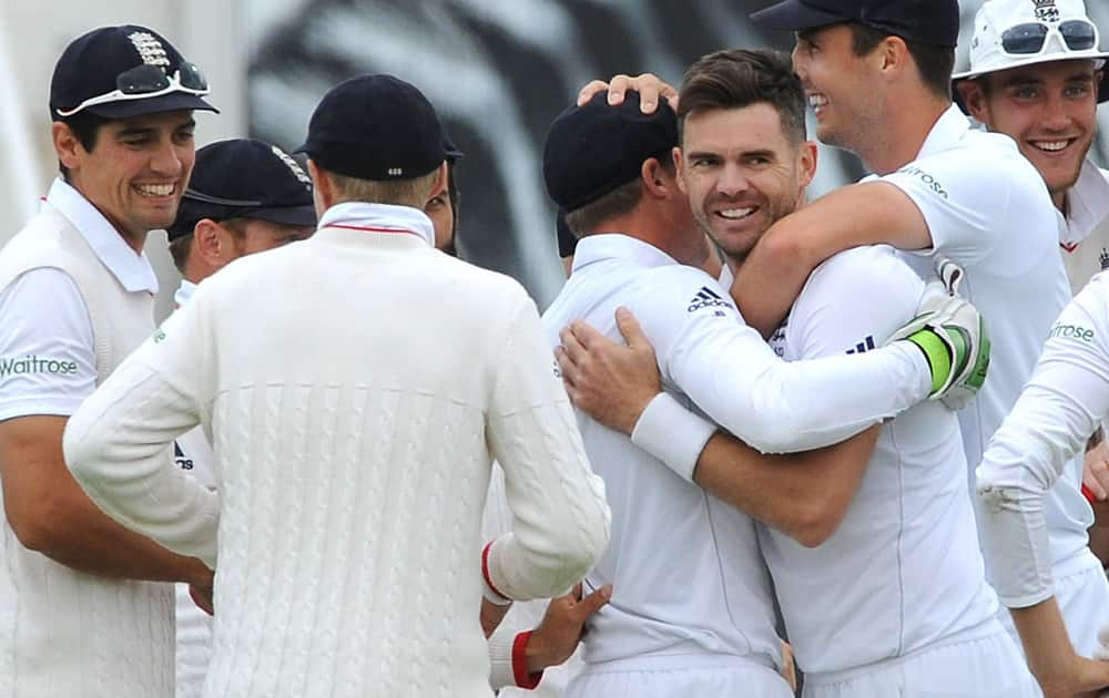 England’s James Anderson celebrates with team mates after bowling Australia’s Mitchell Marsh caught England’s Jos Buttler for a duck during day one of the third Ashes Test cricket match, at Edgbaston, Birmingham, England.