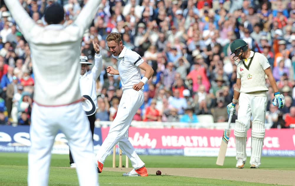 England’s Stuart Broad celebrates after trapping Australia’s Chris Rogers LBW for 52 runs during day one of the third Ashes Test cricket match, at Edgbaston, Birmingham, England.