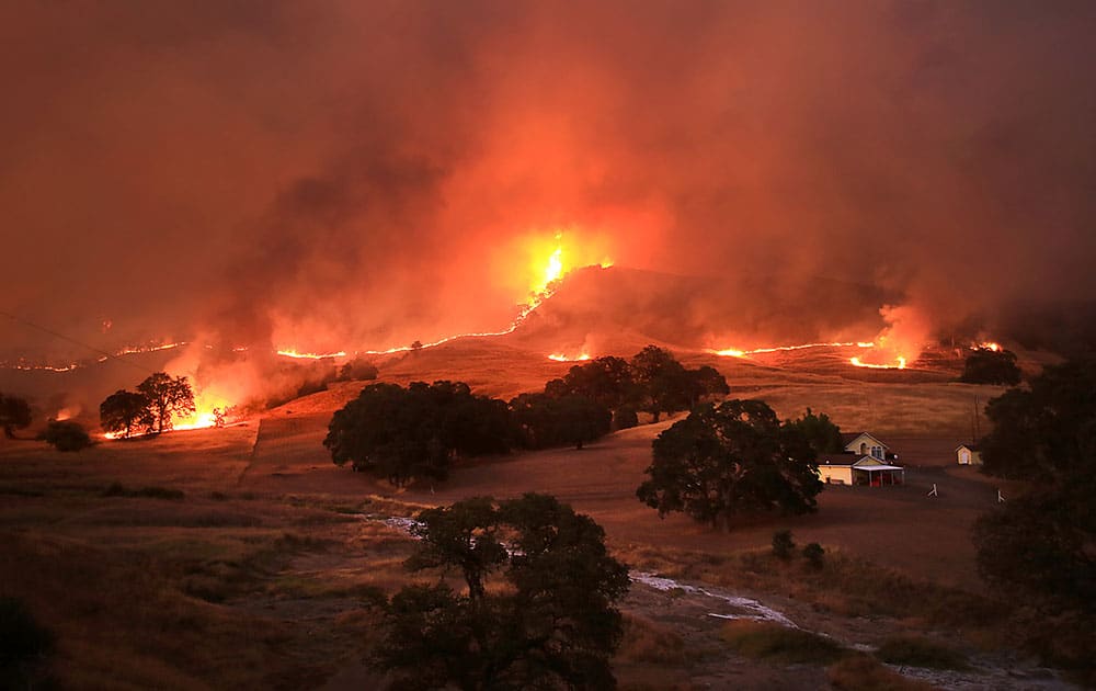 Flames consume the landscape at the Rocky Fire, near Lower Lake, Calif.