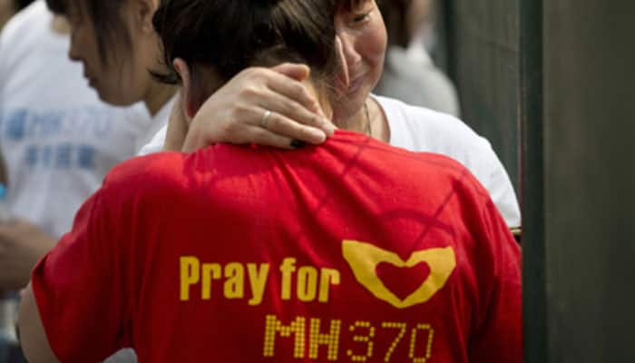 Relatives torn over possible first debris from missing MH370