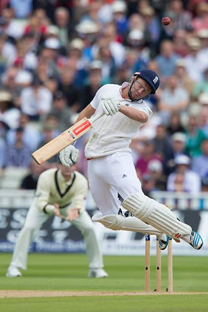 England's Jonny Bairstow reels away from as bouncer as he looses his wicket for 5 caught by Peter Nevill off the bowling of Australia's Mitchell Johnson on the second day of the third Test match of the five match series between England and Australia at Edgbaston cricket ground in Birmingham, England.