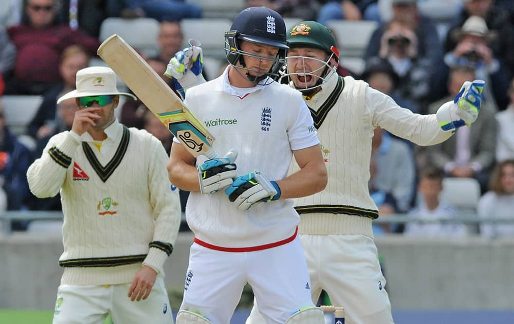 Australia’s Peter Nevill celebrates after England’s Jos Buttler is trapped LBW by Australia’s Nathan Lyon for 9 runs during day two of the third Ashes Test cricket match, at Edgbaston, Birmingham, England.