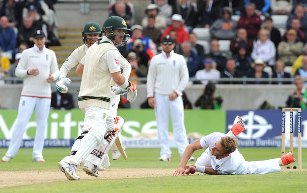 England’s Stuart Broad, right, attempts to stop the ball watched by Australia’s David Warner, left, during day two of the third Ashes Test cricket match, at Edgbaston, Birmingham, England.