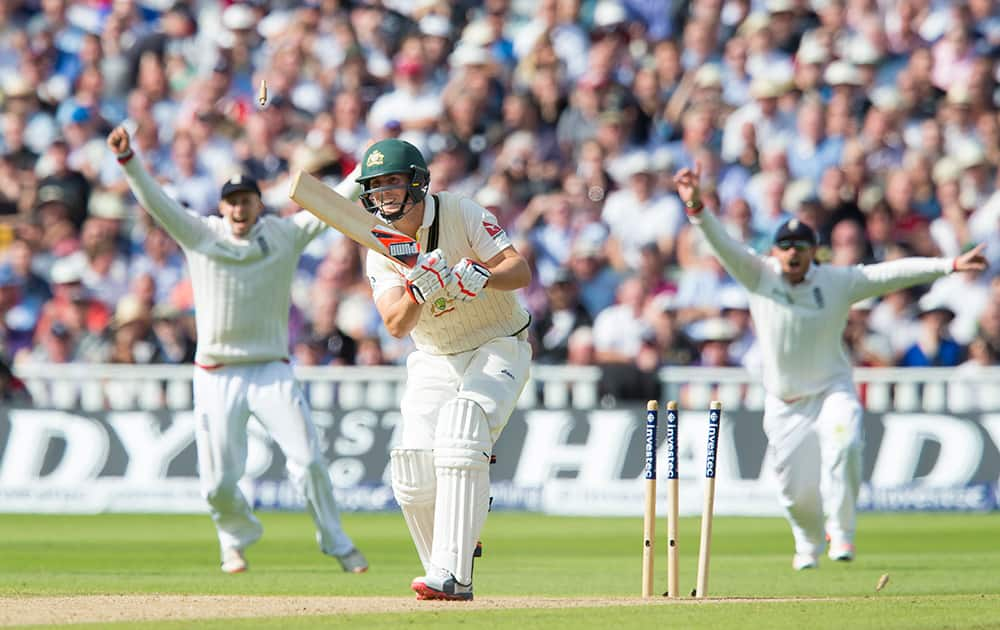 Australia's Mitchell Marsh is bowled for six by England's Steven Finn on the second day of the third Test match of the five match series between England and Australia at Edgbaston cricket ground in Birmingham, England.