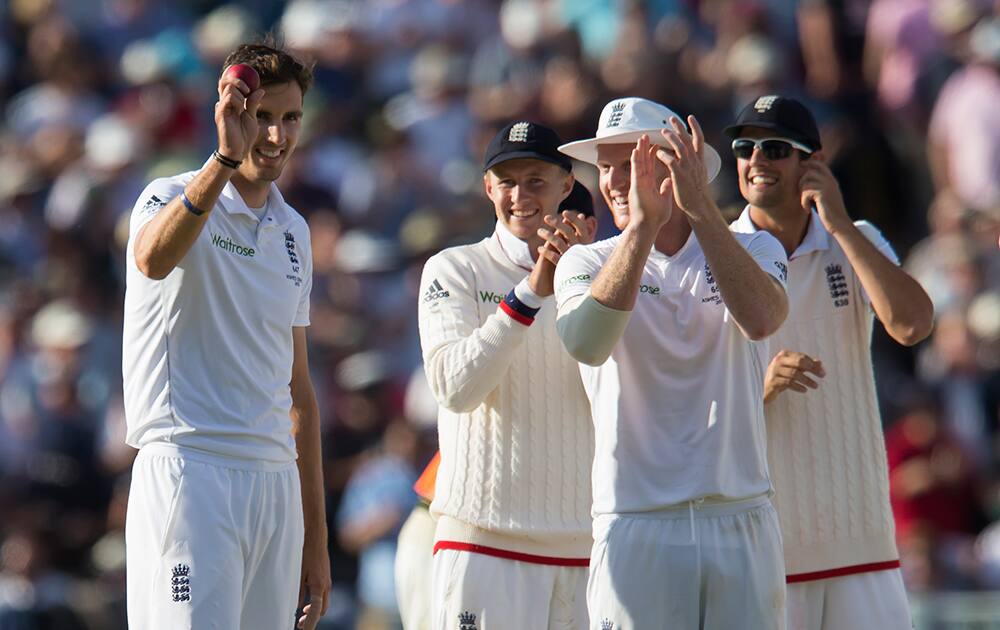 England's Steven Finn, celebrates taking his fifth wicket of the day, that of Australia's Mitchell Johnson, caught by Ben Stokes for 14 on the second day of the third Test match of the five match series between England and Australia at Edgbaston cricket ground in Birmingham, England.