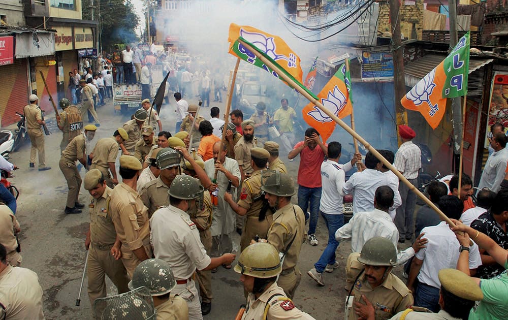 Police intervene to stop clashes between AIIMS Coordination Committee supporters and BJP activists in Jammu.
