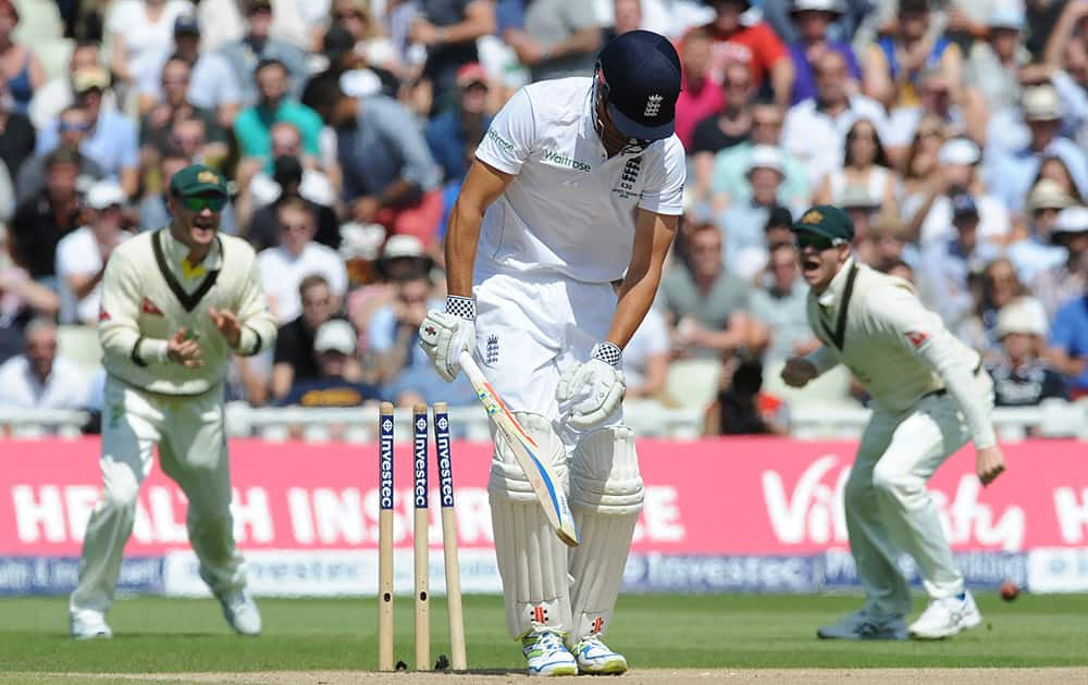 England’s Alastair Cook bowled by Australia’s Mitchell Starc during day three of the third Ashes Test cricket match, at Edgbaston, Birmingham, England.