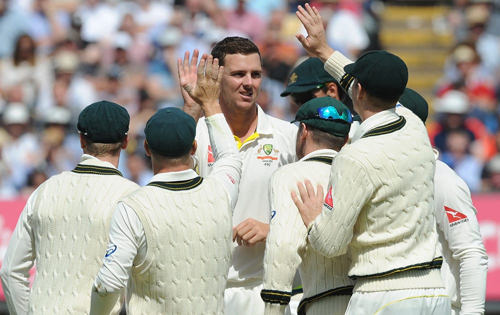 Australia’s Josh Hazlewood is congratulated by teammates after trapping England’s Adam Lyth LBW during day three of the third Ashes Test cricket match, at Edgbaston, Birmingham, England.