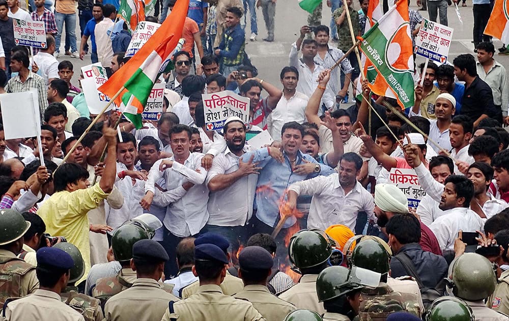 Youth Congress workers protest against the ceasefire violation by Pakistan at Chanakya Puri in New Delhi.